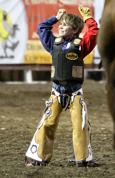 Pete wins steer ride, age 7, Cody, Wyoming.