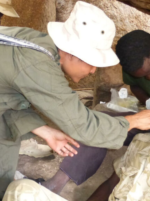 Ray Kaw treating a patient in 2014.