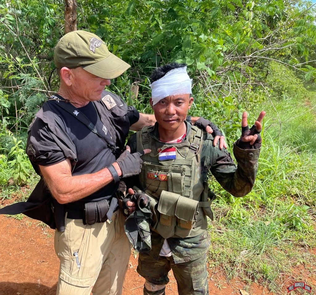David Eubank with a wounded Karenni soldier.