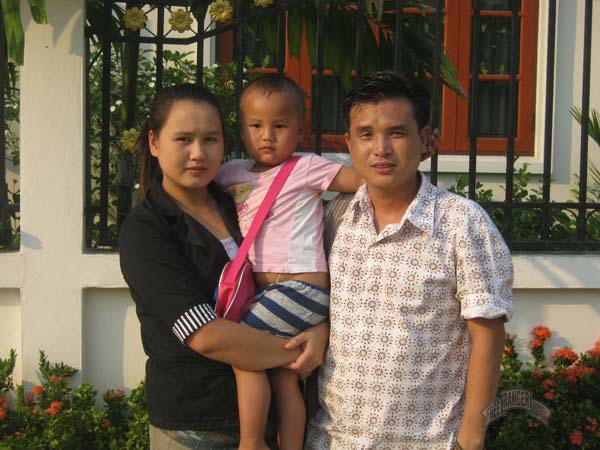 Lahu team leader Kyar Shell with his wife and son
