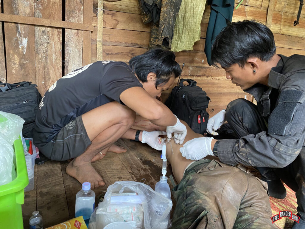 Medical care for a resistance fighter who was wounded by shrapnel. 