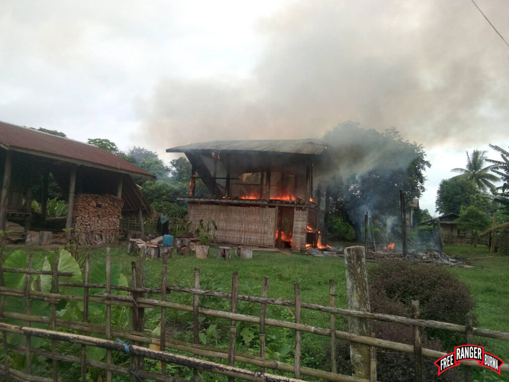 House burning after military jets bombed Mya Le Village.