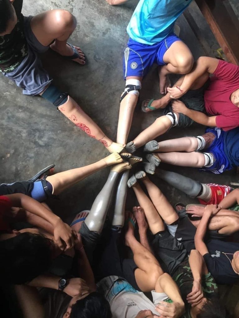 Amputees are all across Burma. These amputees in Dooplay District, Karen State, proudly celebrate their new legs. 