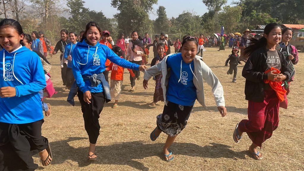 Children run together doing GLC.