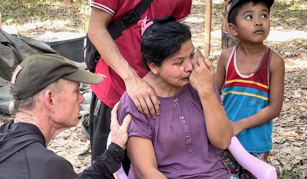 Comforting the mother, who lost her 17-year-old daughter and her husband.