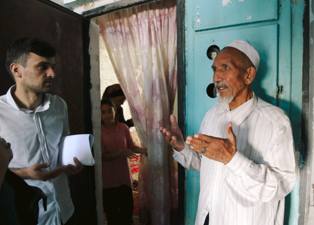 Afghan elder praying for us