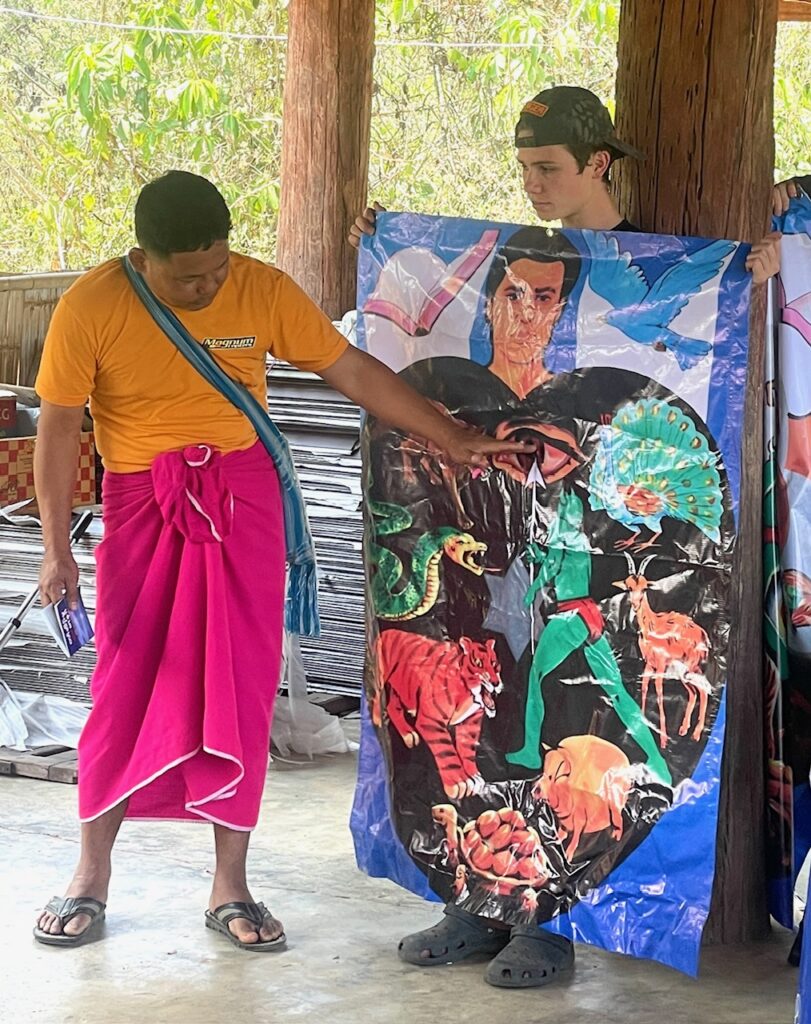 Allan's grandson, Peter, along with Pastor Samuel using his tract.