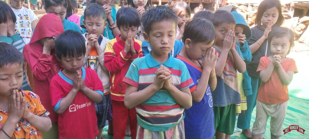 January 12: Children praying during GLC program.