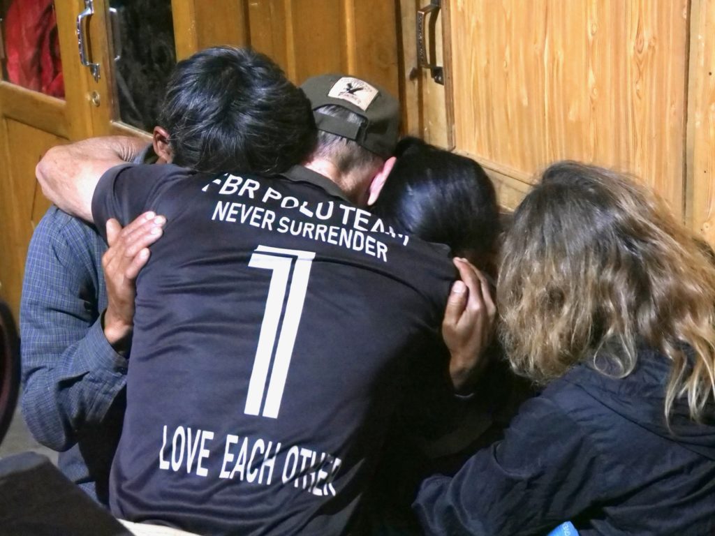 Dave and Karen comforting Vittorio's parents. 