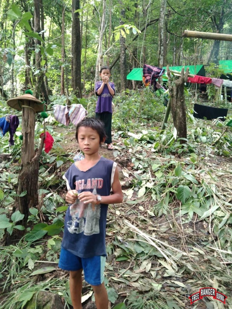 Children who fled from Sa Le Village, in their hiding place in the jungle.