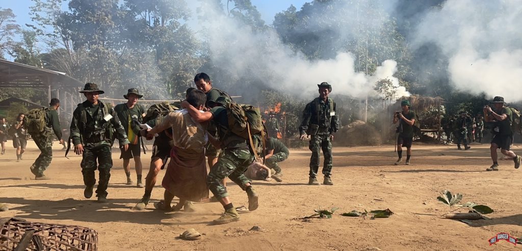 Rangers practice rescuing villagers during a village attack simulation exercise
