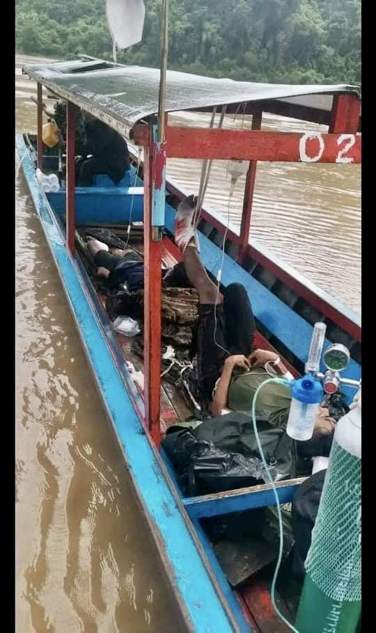 Wounded and dead being evacuated by boat after the 4 July bombing in Karen State.