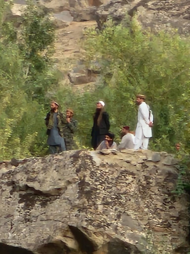 A group of Taliban watching as our team ministers to people along the Afghan/Tajik border.
