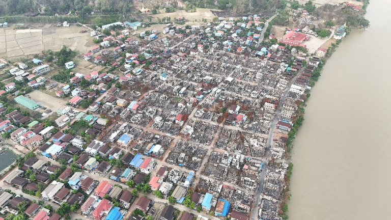 Town partially destroyed by Burma military strikes.