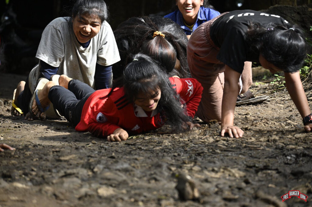 IDPs learning artillery response training. This will prepare them for incidents when mortar attacks land in their IDP camp.
