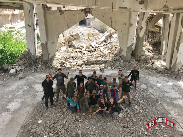 FBR team praying in the ruined sanctuary