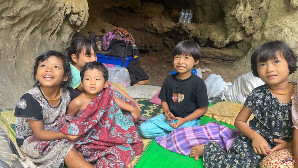 Still able to smile, children respond to our visit. 