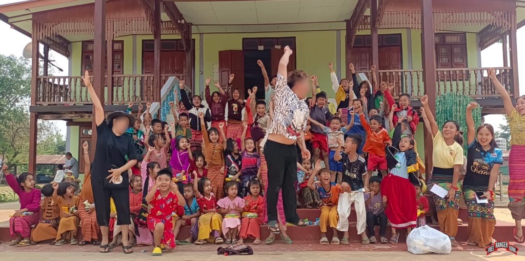 Rangers cheer with children after a GLC program.