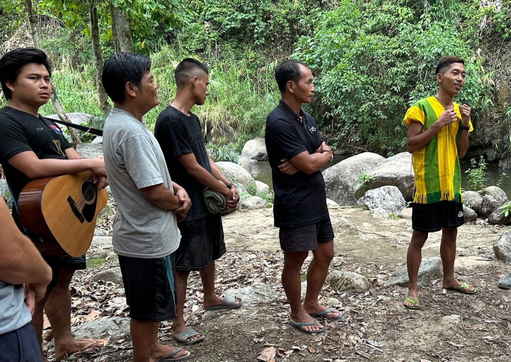 Blade, in yellow, shares why he wants to follow Jesus.