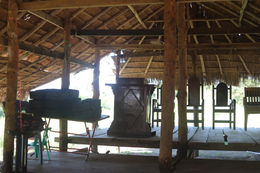 The IDP church is located in a field just like all the other IDP shelters