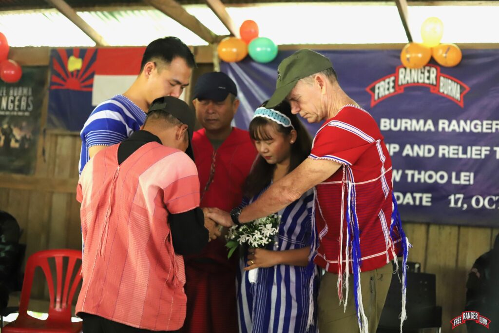 Wedding prayer for Aung Zaya and Lin.