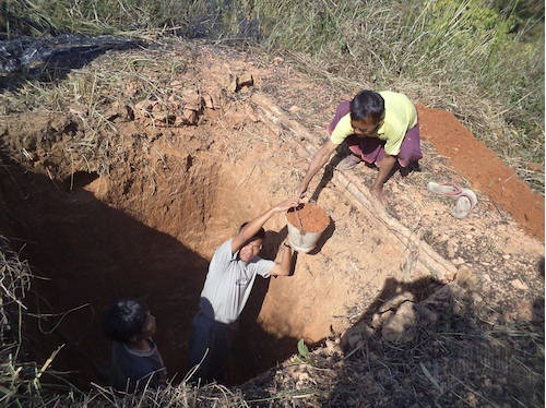 FBR helps build a latrine in O— Village, which was destroyed by the Burma Army on 10 June 2000. After the villagers fled, only a fraction returned. Photo 11 February 2012