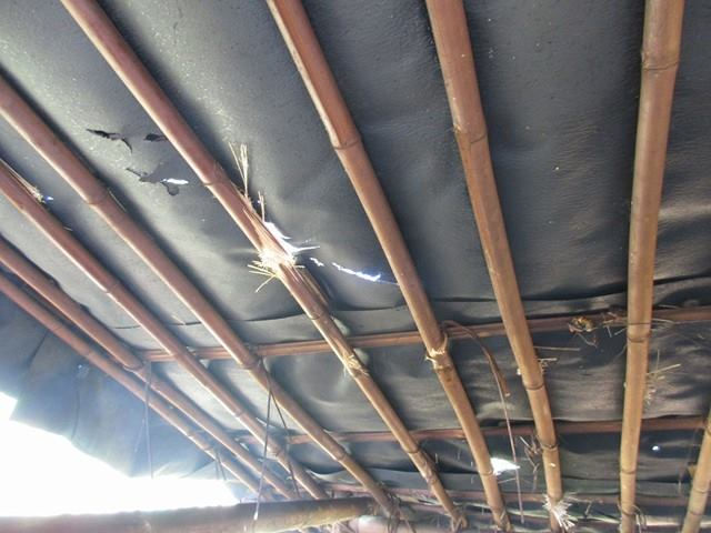 Damage to a house after a mortar fell through the roof.