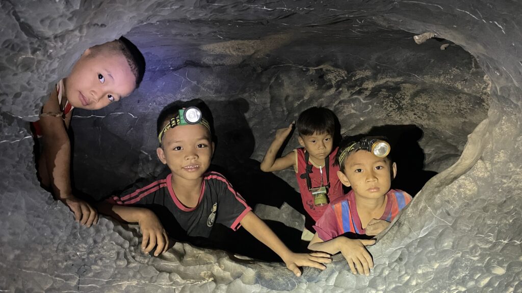 Children hiding from airstrikes in Burma.