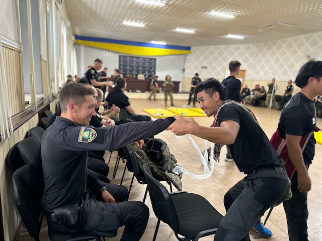 Medical training; Eliya’s sons, Tomas and Poe Du, help out.