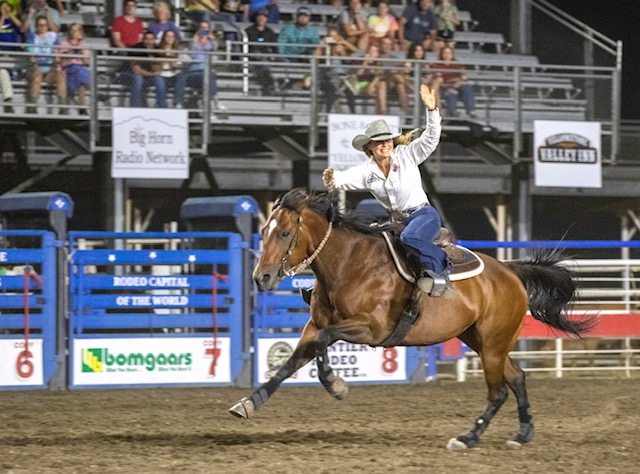 Suu waves to the crowd after a good race.