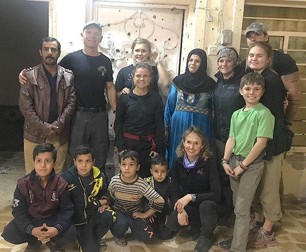 Omar, back in his home with his wife and four sons, and the FBR team.