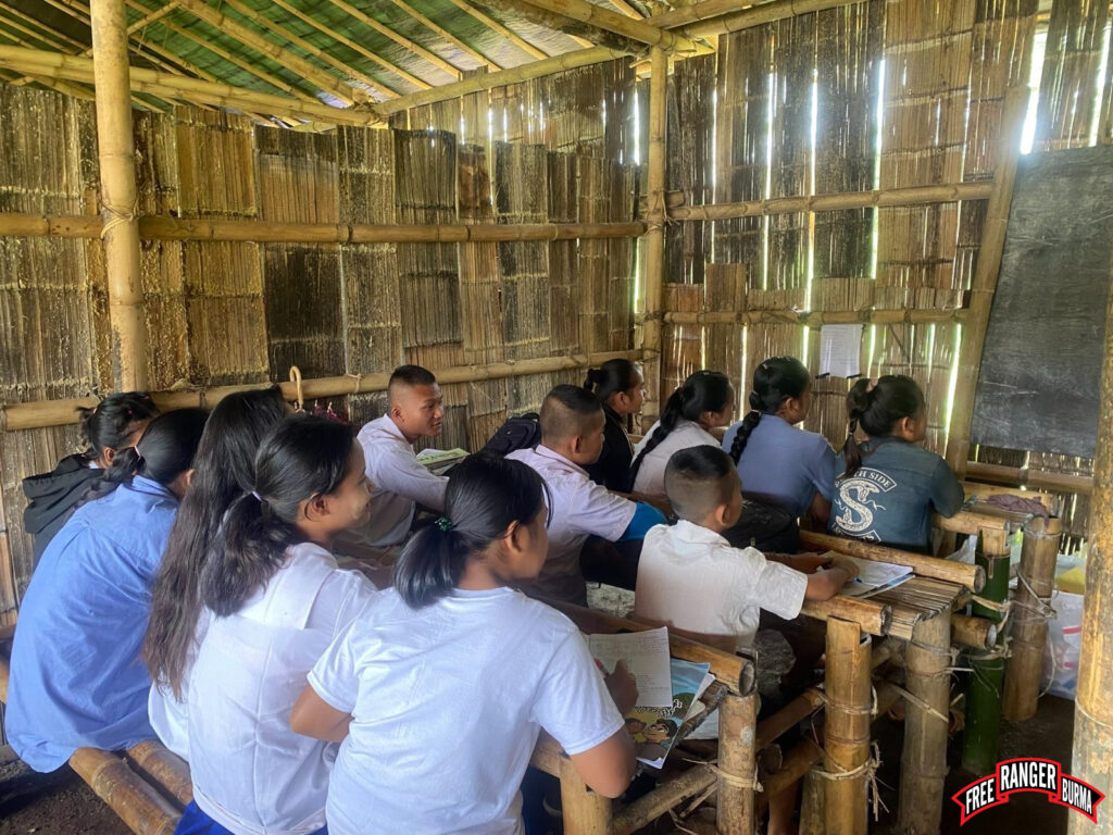Local students learning English from an FBR volunteer at their school.