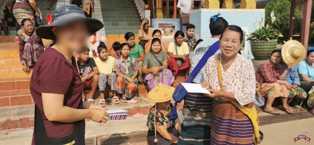 FBR team member giving funds to an IDP family head.