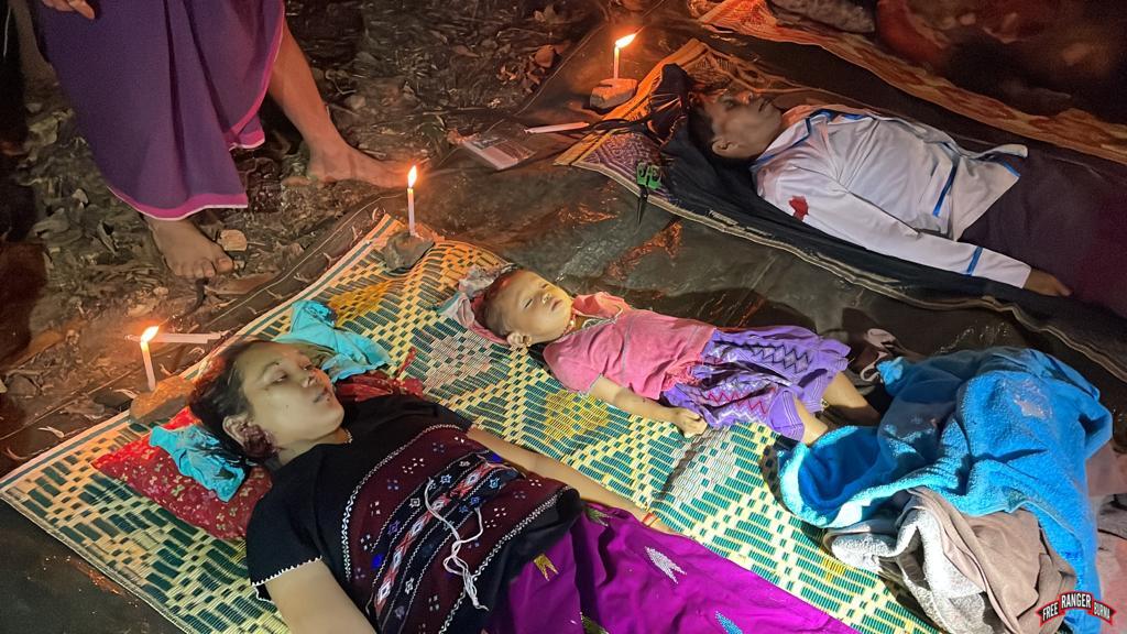 The bodies of the mother, Lah Kler Paw, baby Marina, and deacon Ready Htoo.