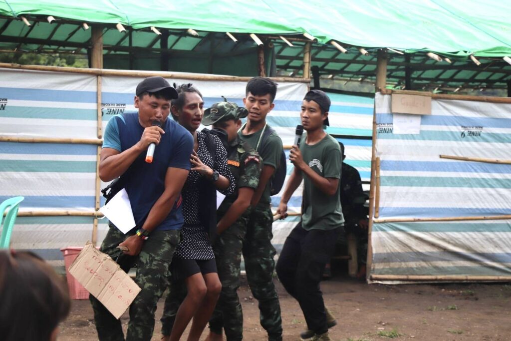 Dabyano, in blue, putting on a show for the kids.