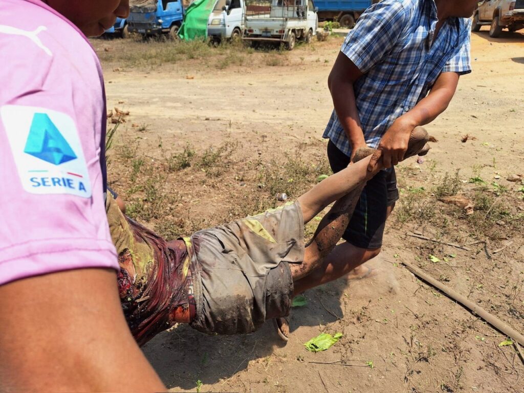 Carrying one of the dead.