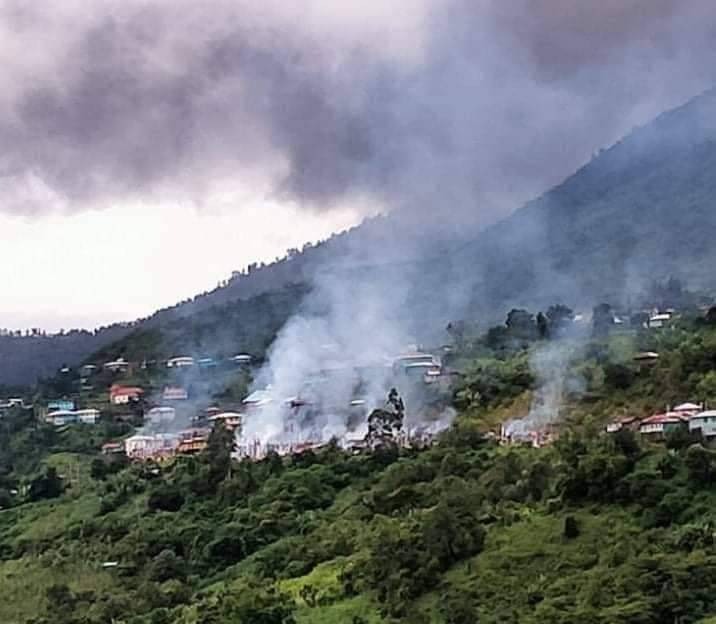 Burning houses from Chuncung Village, in Hakha Township.