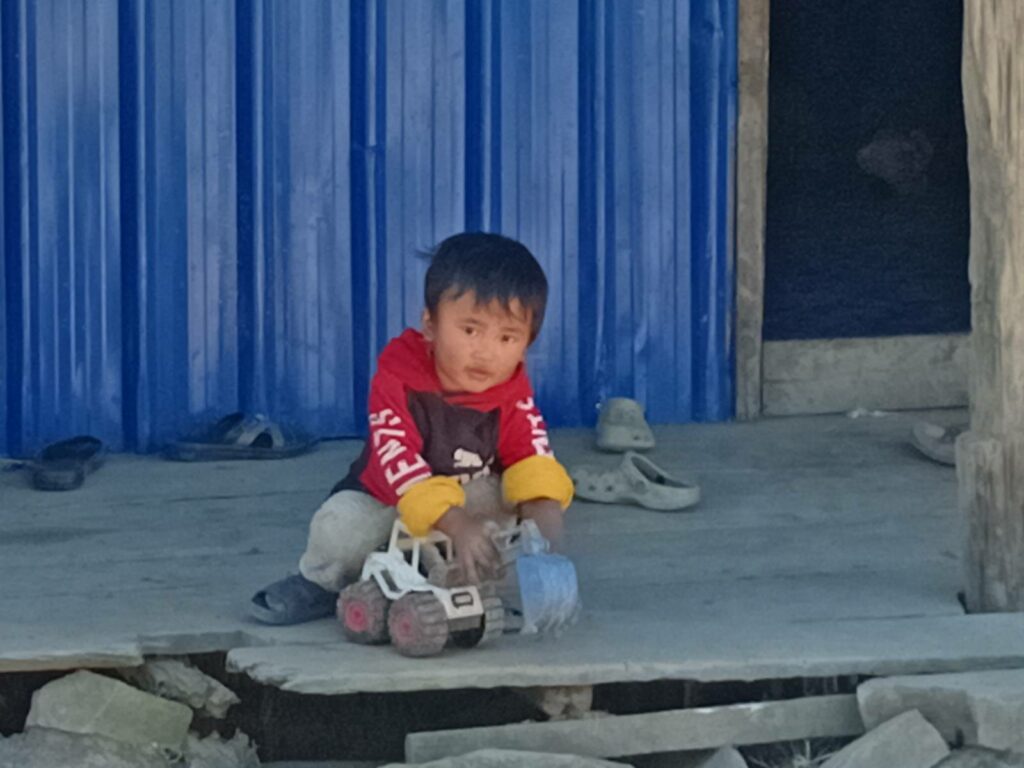 An IDP child playing close to home.