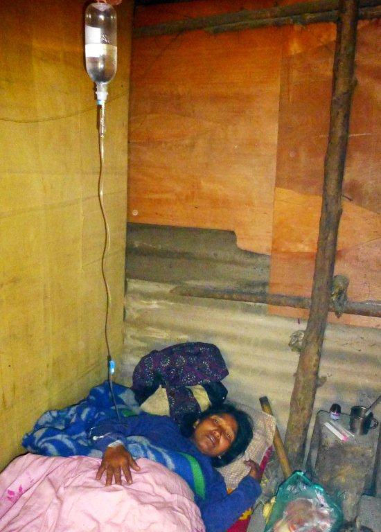 Sick woman in IDP shack Kachin state