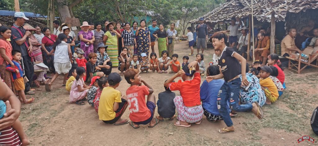 Adults join in on the fun with the children during a GLC game.