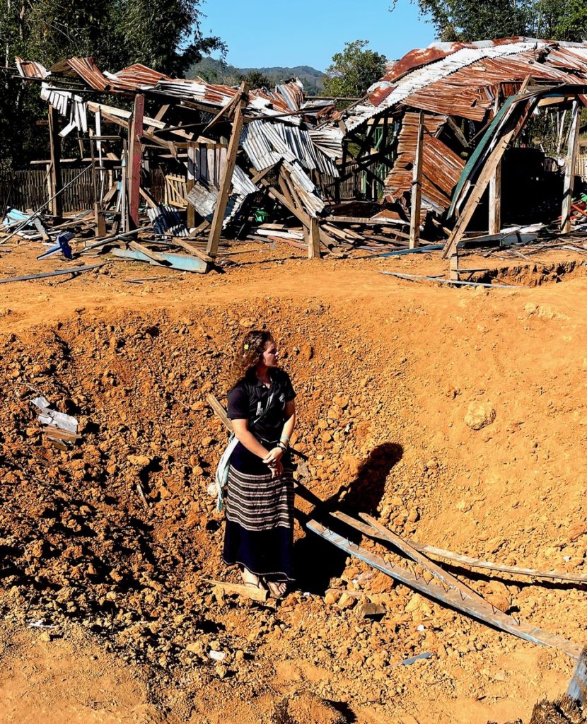 Suu in bomb crater at destroyed church, Karen State
