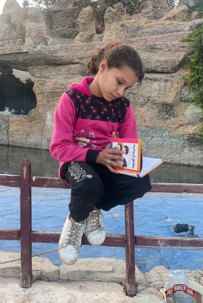 Syrian girl reads children’s Bible we gave her.
