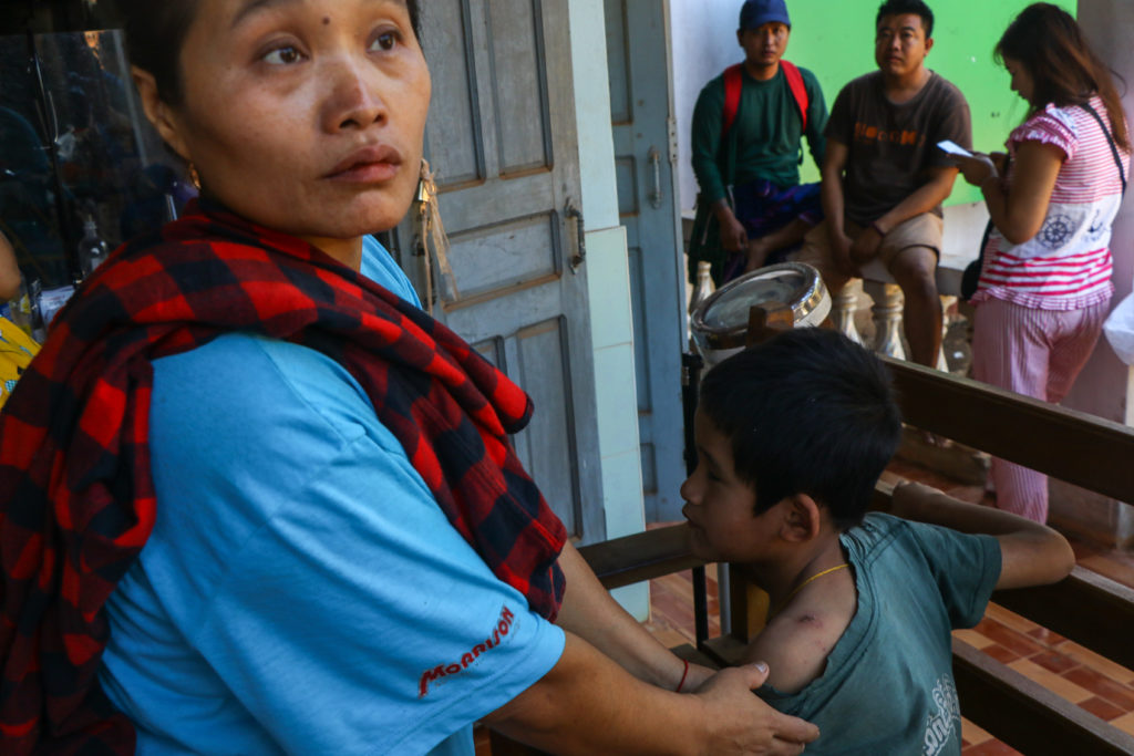 A blind child was also injured in the shelling. Here he is seen with his mother and the wound to his shoulder is visible.