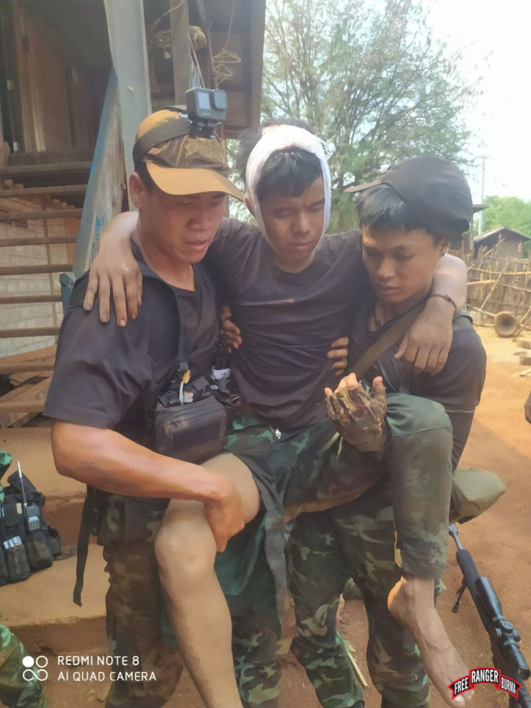 Karenni Ranger medics evacuate a wounded resistance fighter away from the front line.