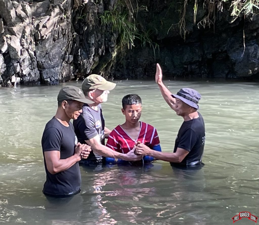 Shay Reh being baptized.