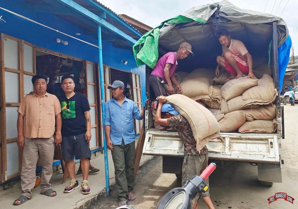 Handing out rice for Vaphai refugee camp.