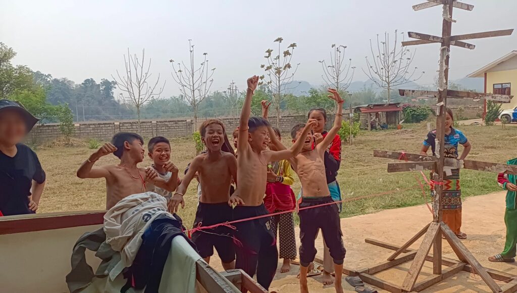 Young IDP boys laugh during a Junior Ranger exercise.