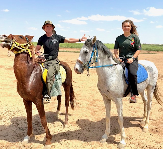 Dave and Suuzanne riding Arabian horses.