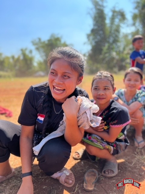 Ranger plays with IDP children during GLC program.