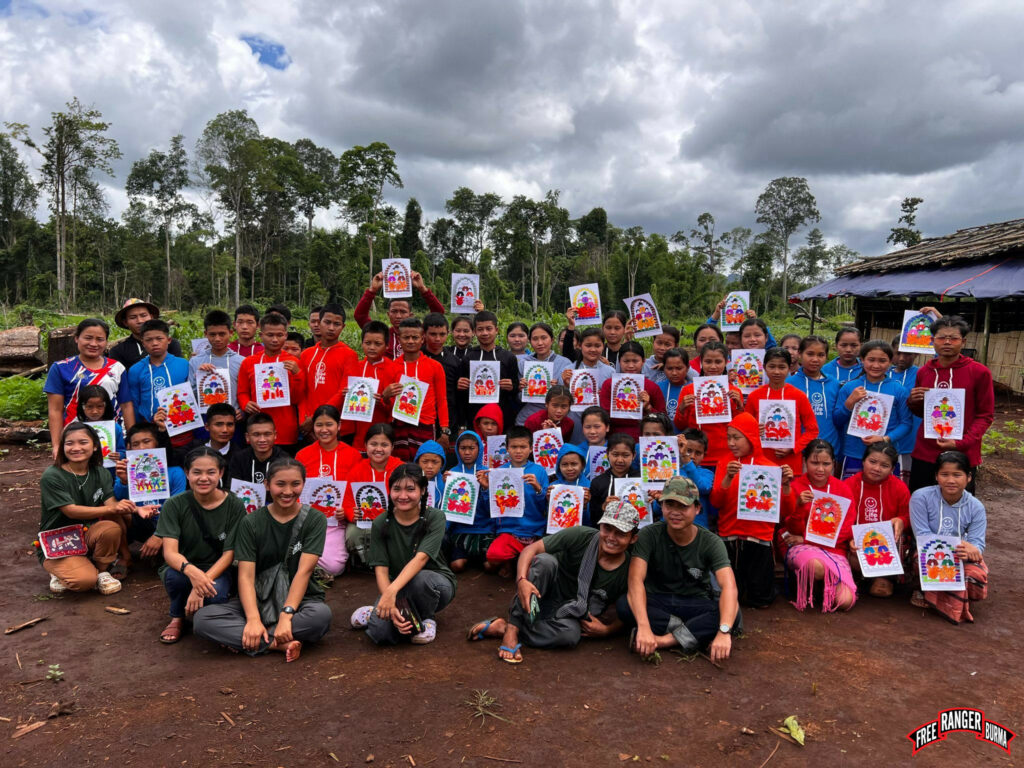High school students and Ranger medics celebrate after a Good Life Club (GLC) program.